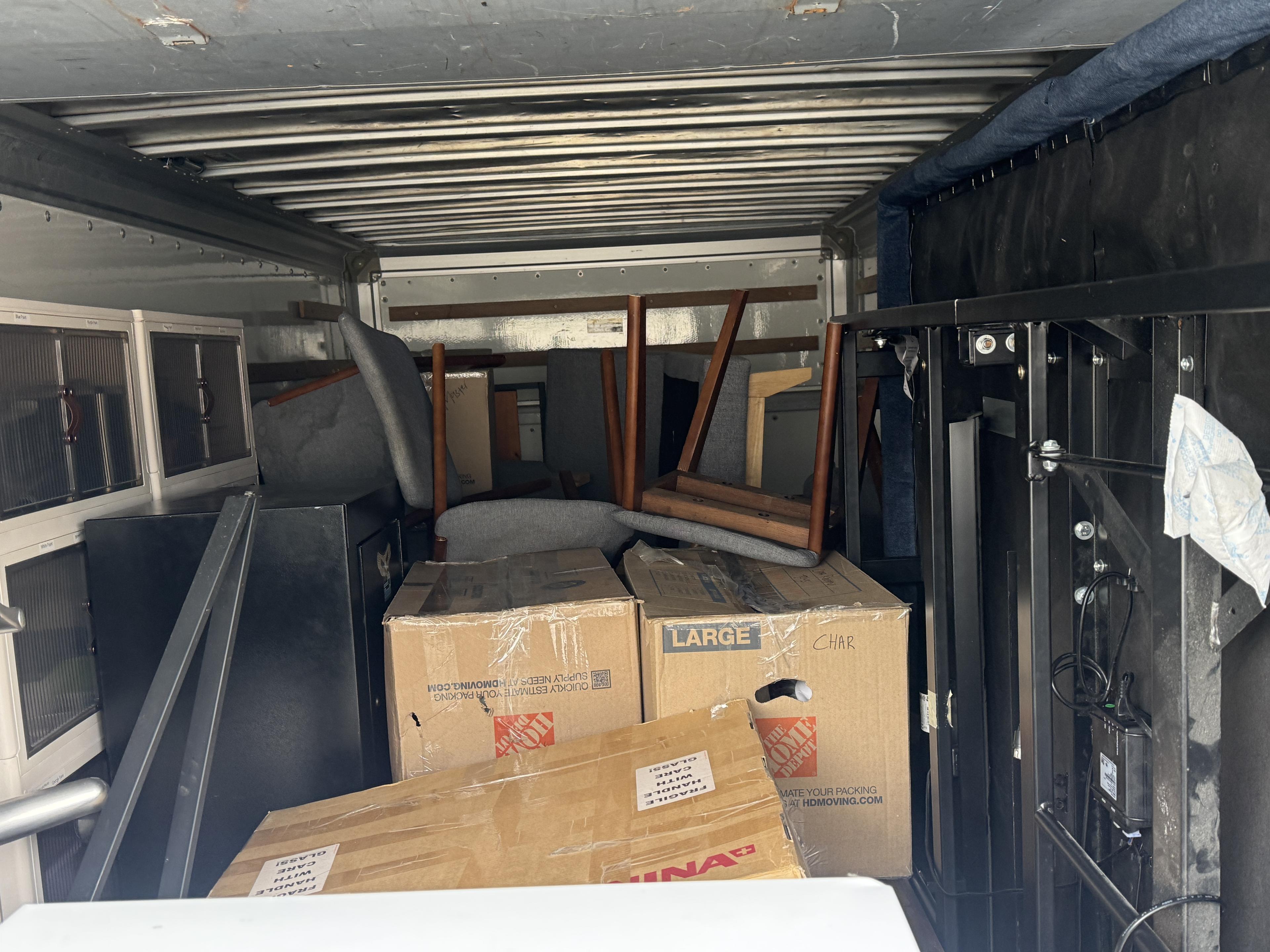 Boxes and furniture loaded inside a Ready Relocation trailer