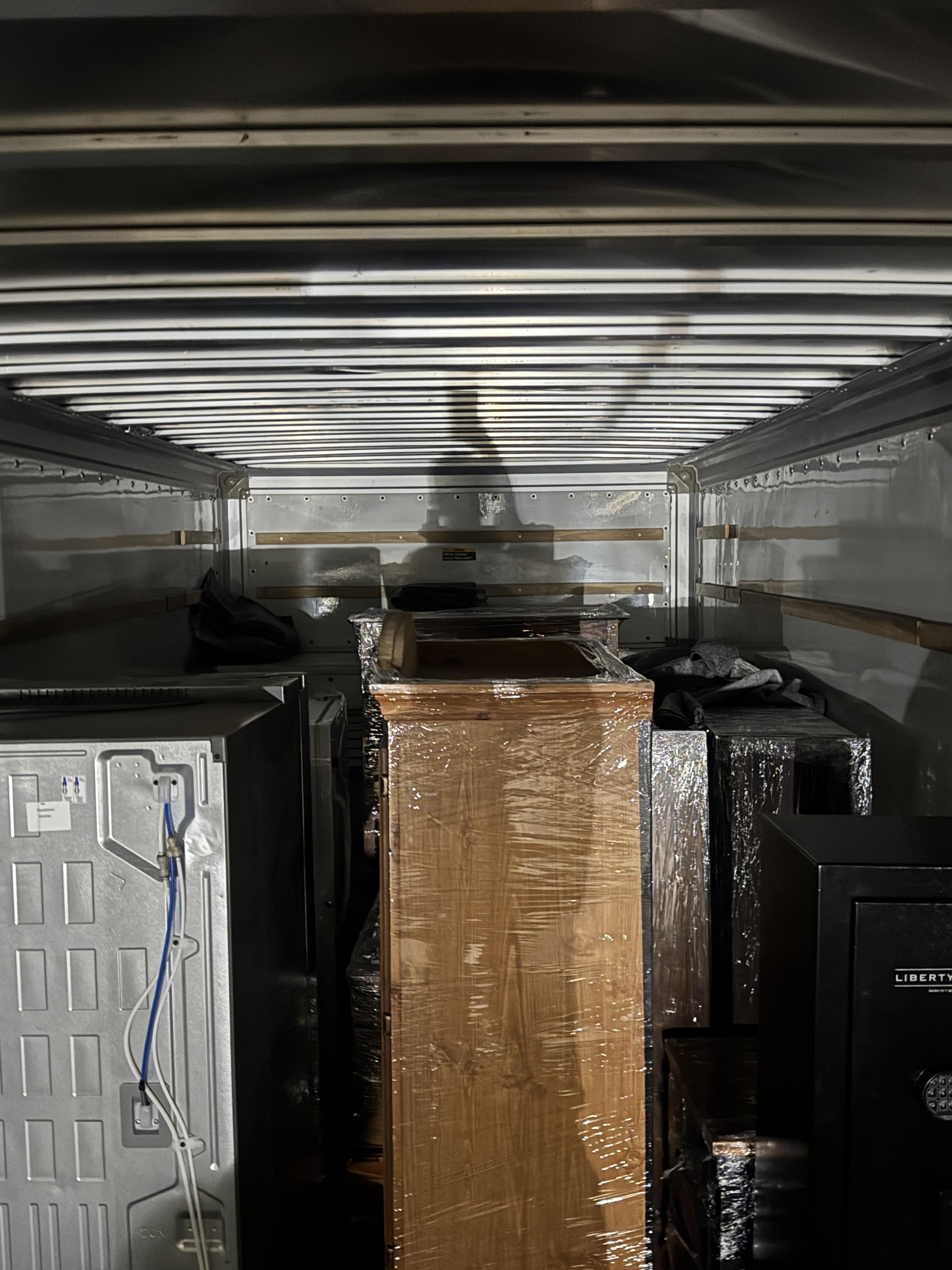 Wrapped furniture inside a moving truck